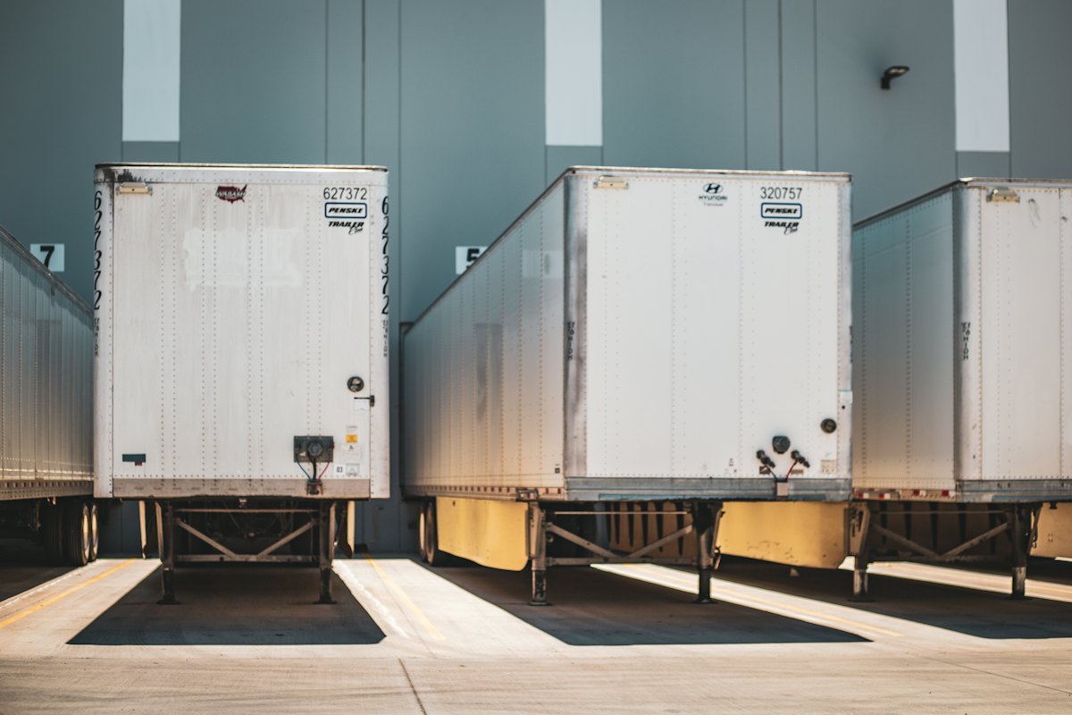 Trailers backed up to warehouse loading docks